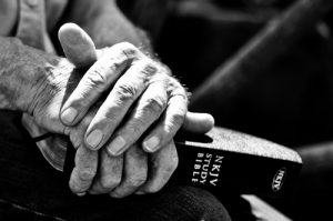 holding bible